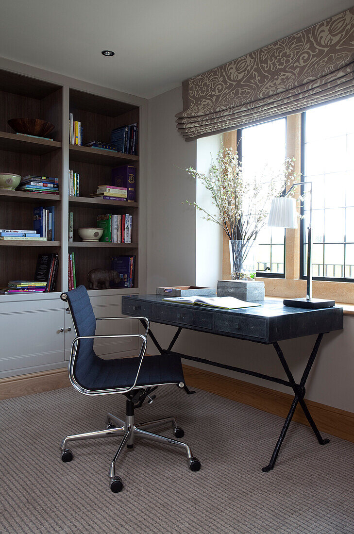 Desk and chair at window of Cotswold home UK