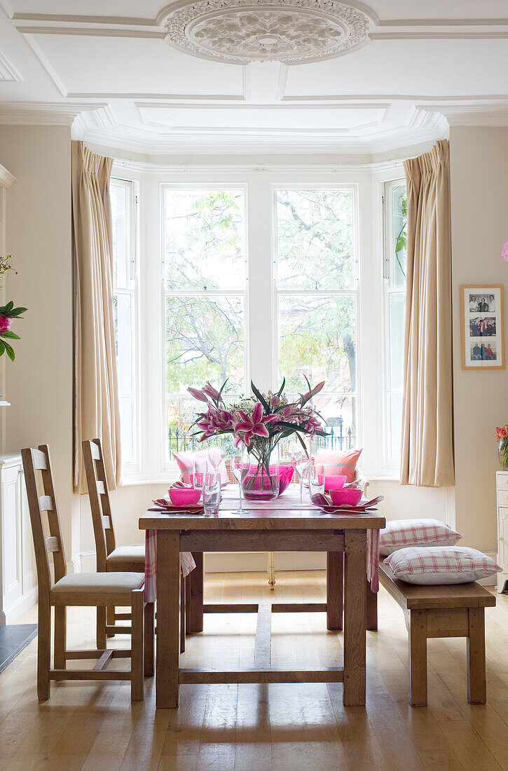 Dining table below ceiling rose in London home UK