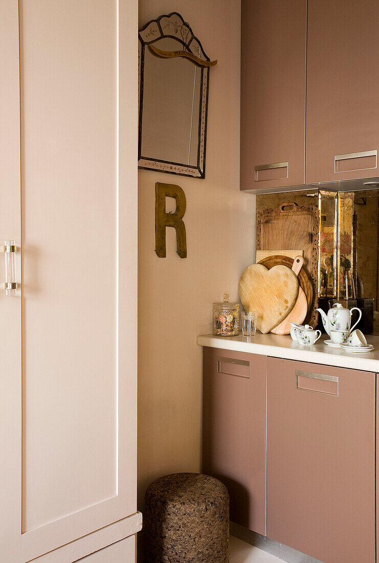 Heart shaped chopping boards and letter R in London kitchen UK