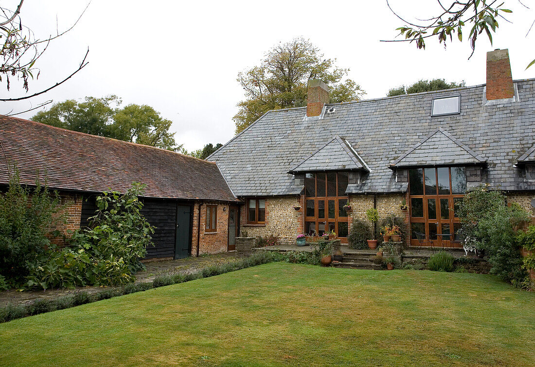 Lawned garden of Sussex farmhouse conversion
