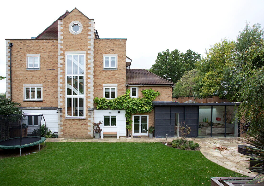 Lawned garden exterior to contemporary London home, England, UK