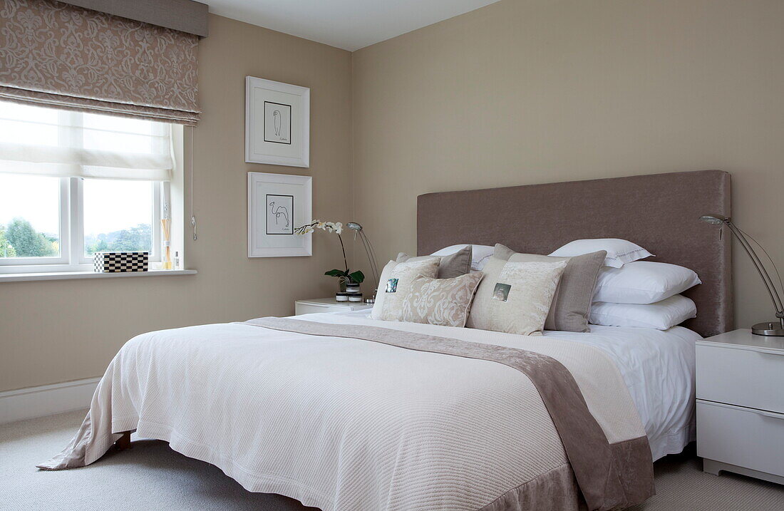 Double bedroom in shades of brown in contemporary London home, England, UK
