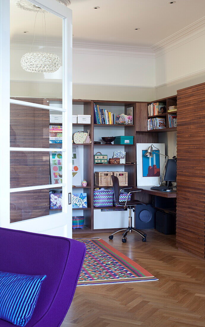 View through doorway to home office in contemporary London townhouse, England, UK