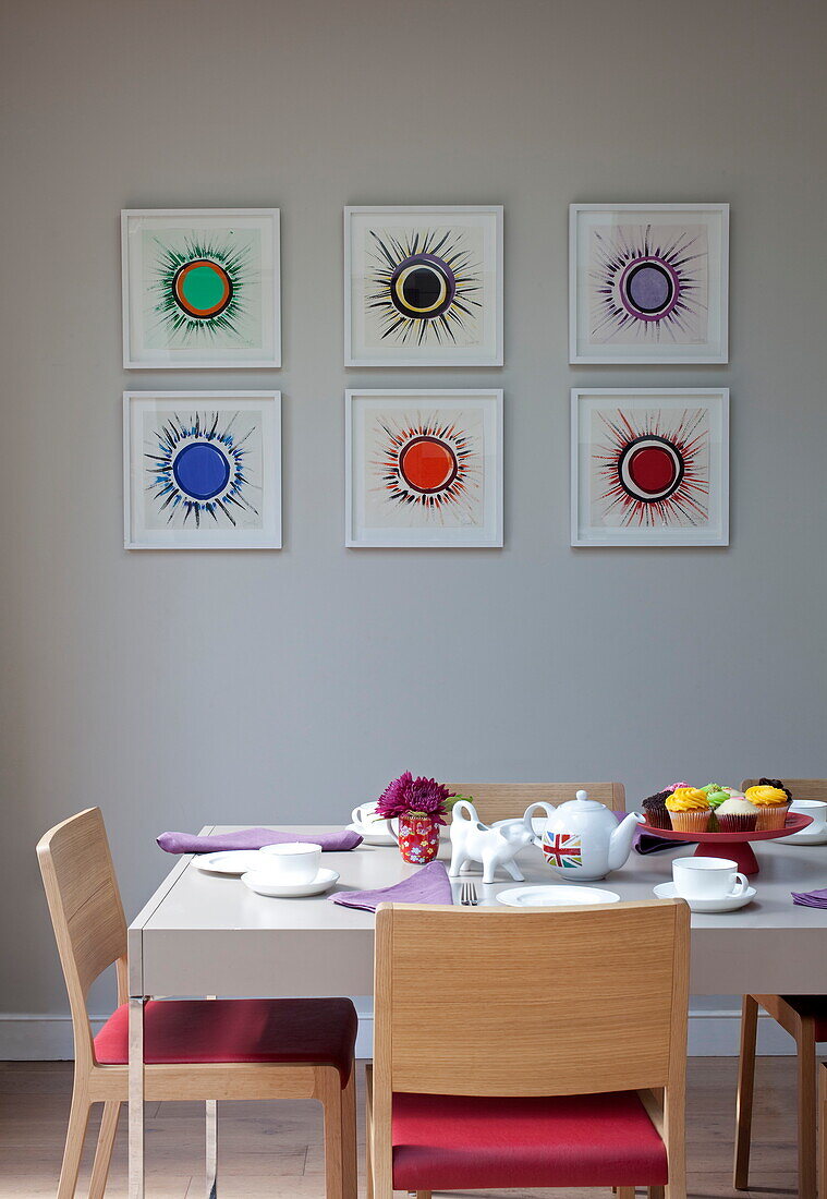 Dining table and artwork in contemporary London townhouse, England, UK