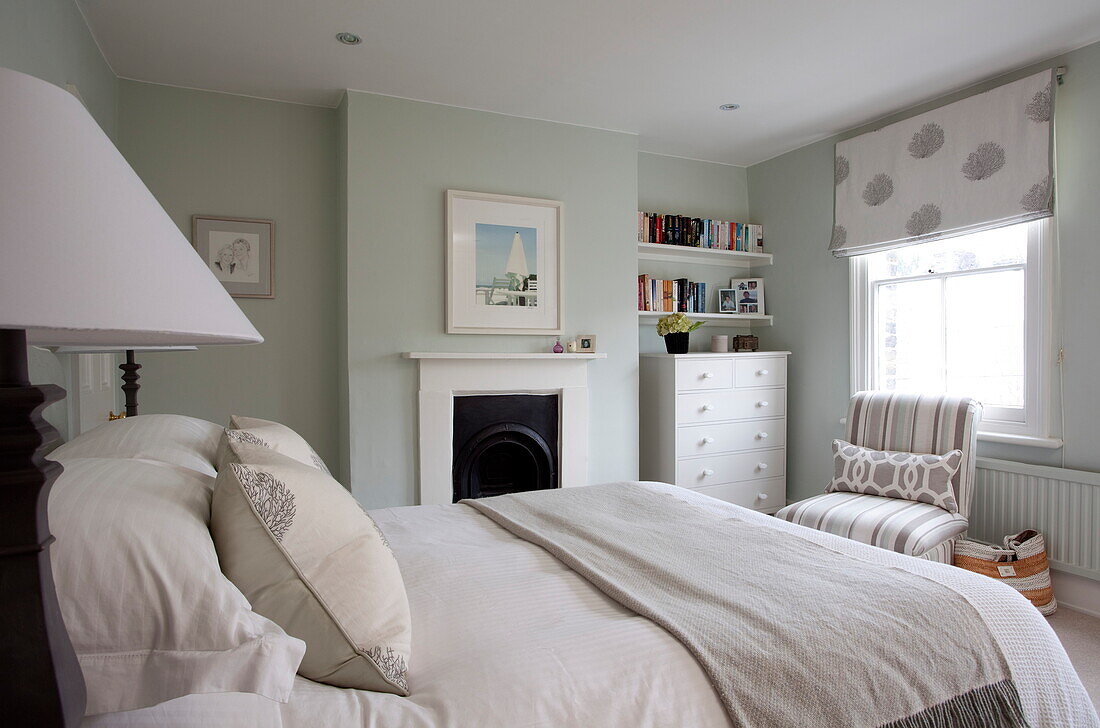 Classic bedroom with recessed storage in London townhouse, England, UK