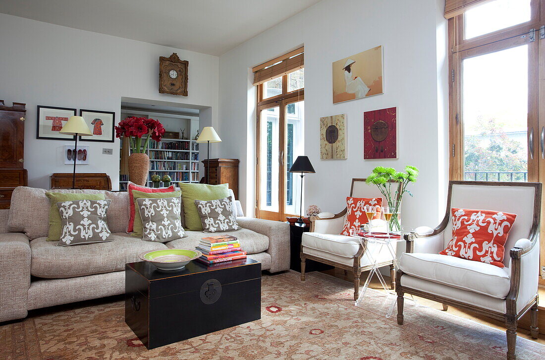 Living room with Chinese travelling chest in contemporary London townhouse, England, UK