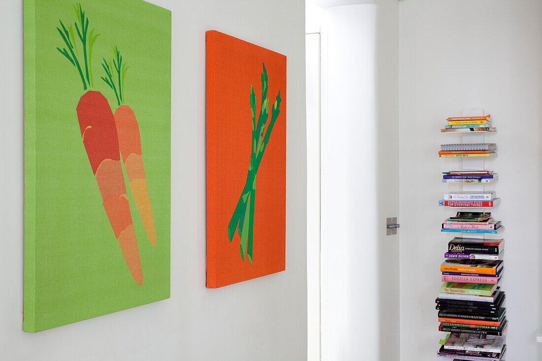 Artwork canvases and book storage in contemporary London townhouse, England, UK