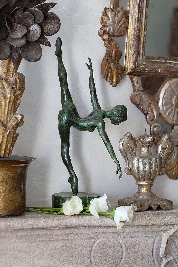 Figurine of a naked dancer with single stem roses in Mougins apartment, Alpes-Maritime, South of France