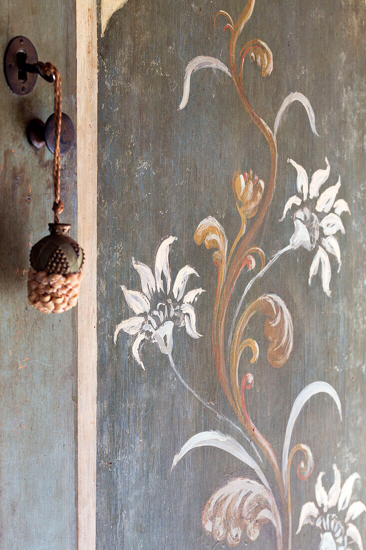 Key and lock with hand-painted door detail in French farmhouse, the Loire, France, Europe