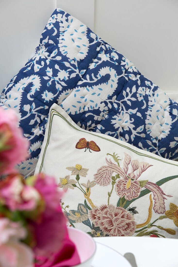 Paisley and floral patterned cushions in London townhouse, England, UK