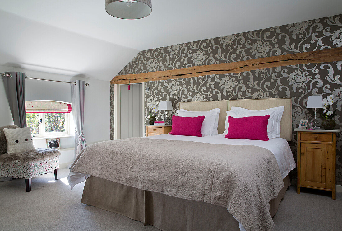 Silver patterned wallpaper in sunlit double bedroom of Sandhurst country house  Kent  England  UK