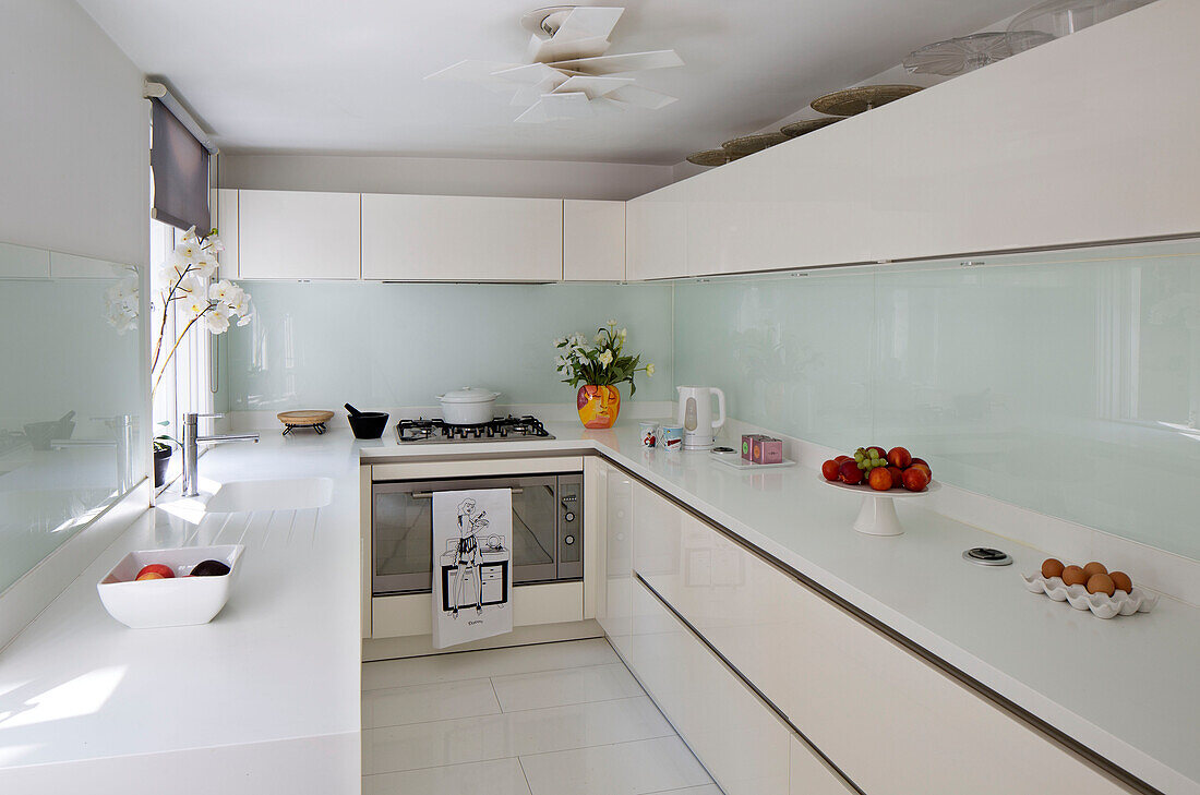 Fruit and eggs in white galley kitchen London townhouse   England   UK