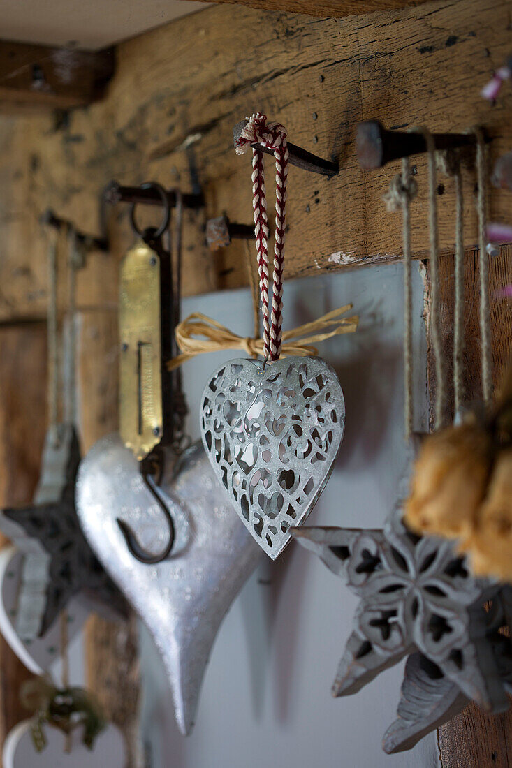 Assorted metal hearts hang in Wokingham cottage Berkshire UK