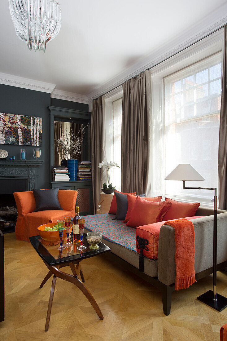 Orange fabrics in London townhouse living room UK