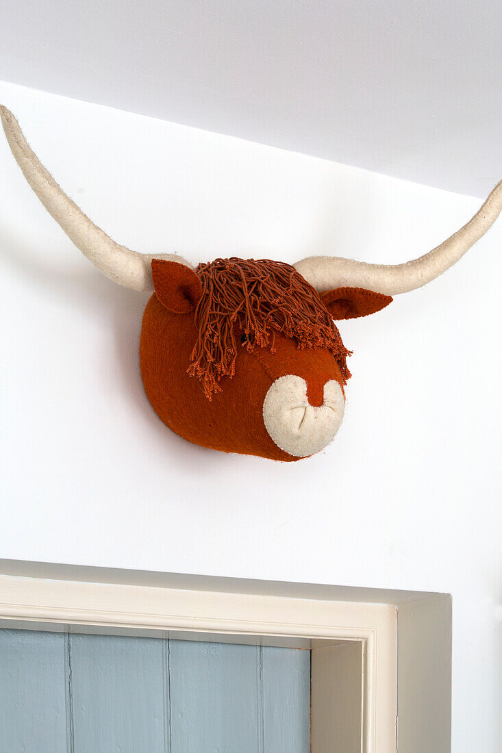 Hand-made Highland cow's head above doorframe in Kelso home Scotland UK