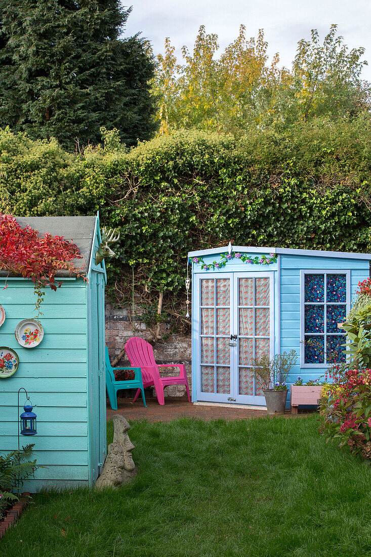 Turquoise shed and summerhouse in Kidderminster garden Worcestershire England UK