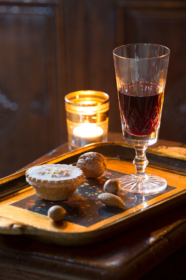 Red wine and mince pies with lit tealight in Hampshire farmhouse England UK