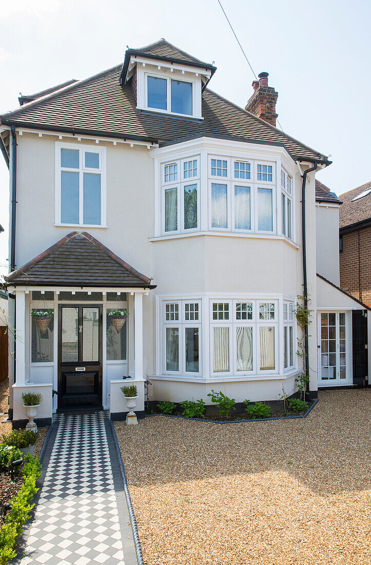 Tiled porch entrance and path to three-storey Edwardian house Surrey UK