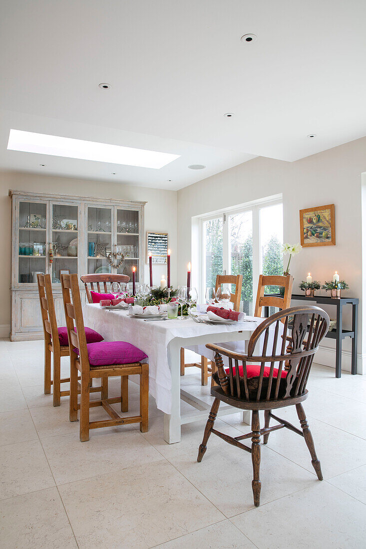 Dining table and chairs in stone floored extension of East Dulwich Edwardian home London UK