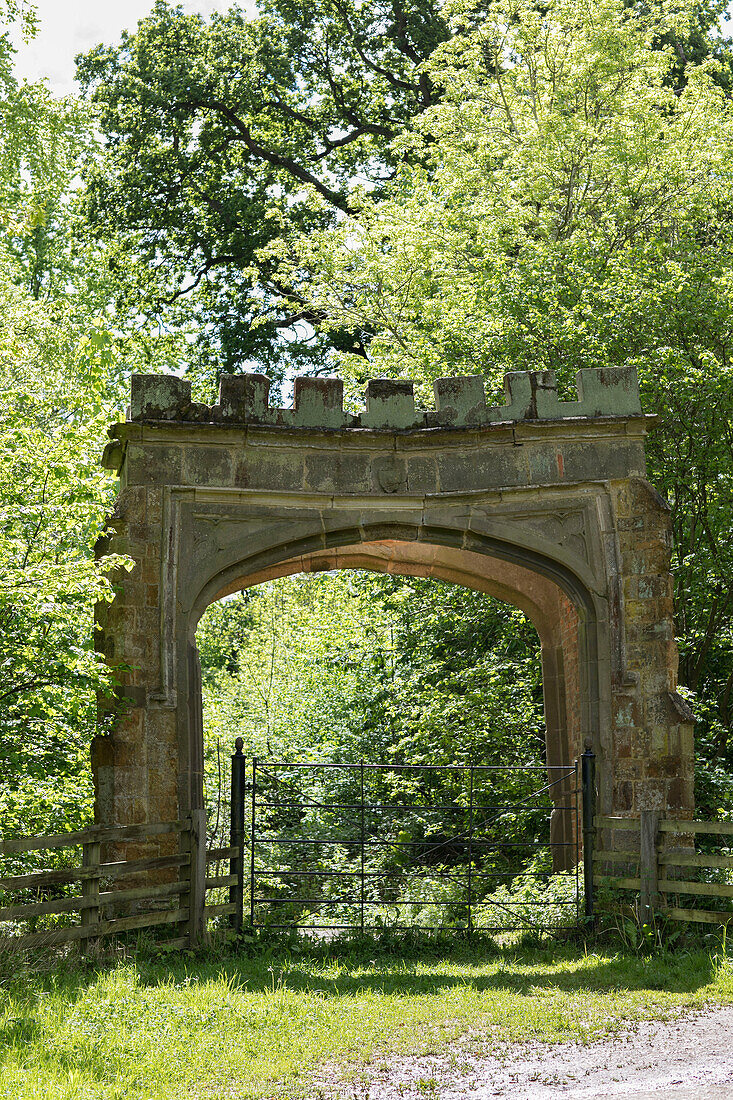 Old stone gateway in Northamptonshire woodland UK