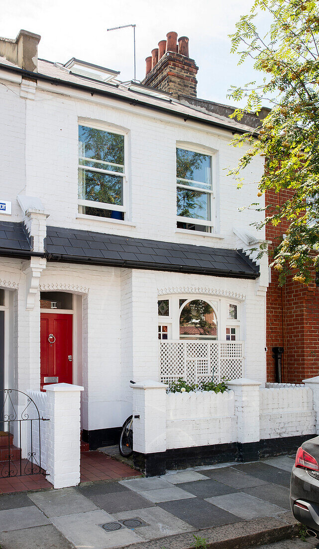 White exterior of Edwardian terraced house London UK