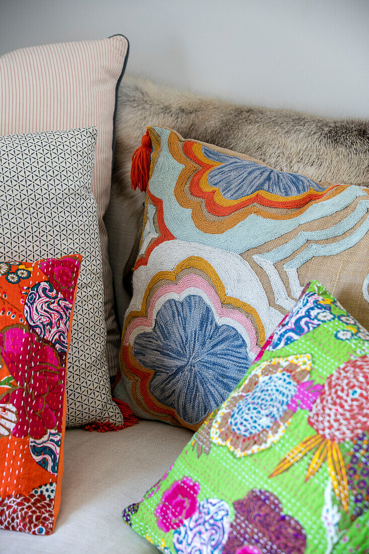 Colourful cushions in Grade II listed cottage Cornwall UK