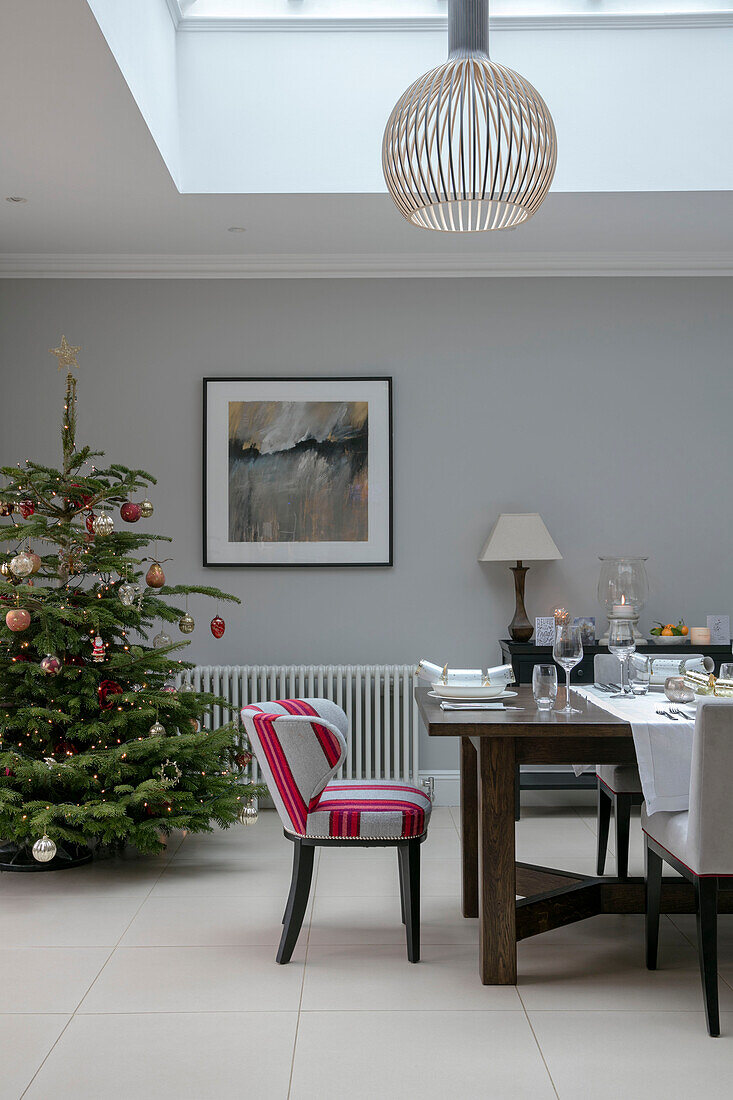 Dining chair at table with Christmas tree in Hampshire home UK