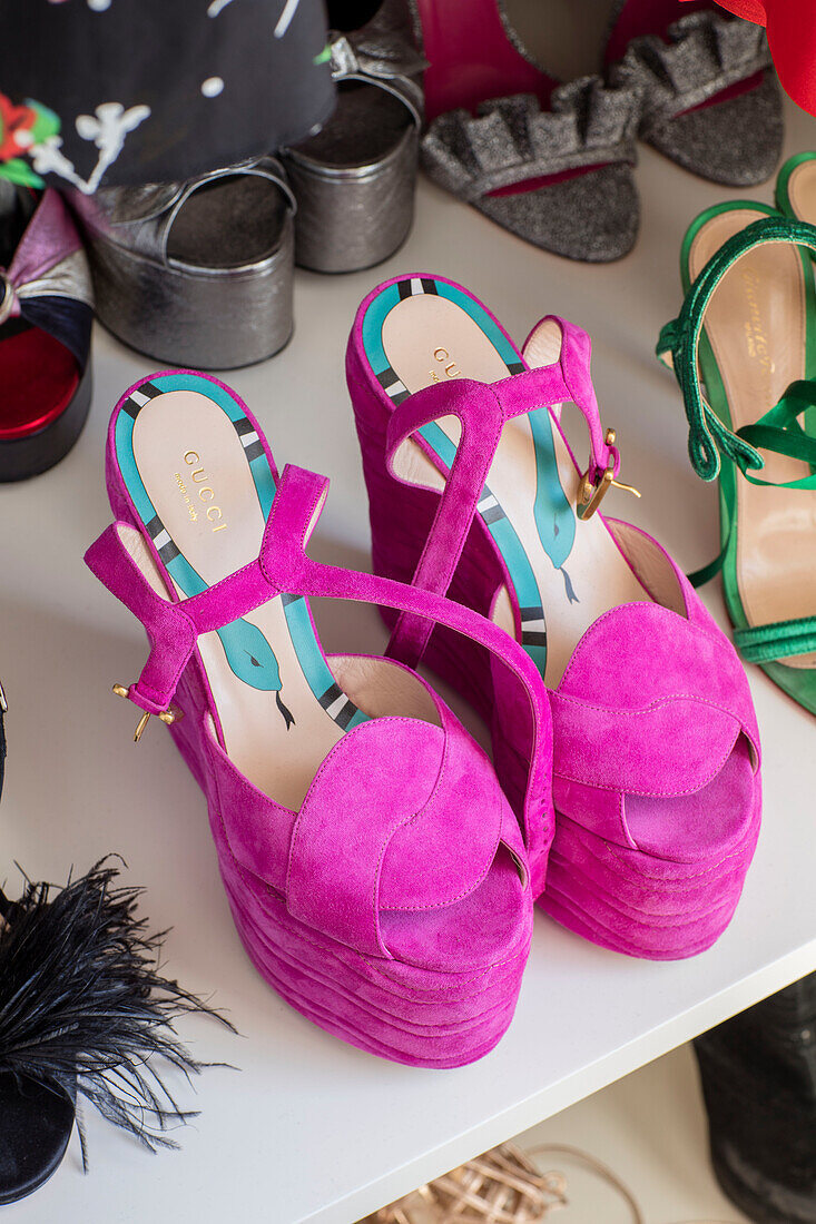 Pair of neon pink platform shoes in London townhouse UK