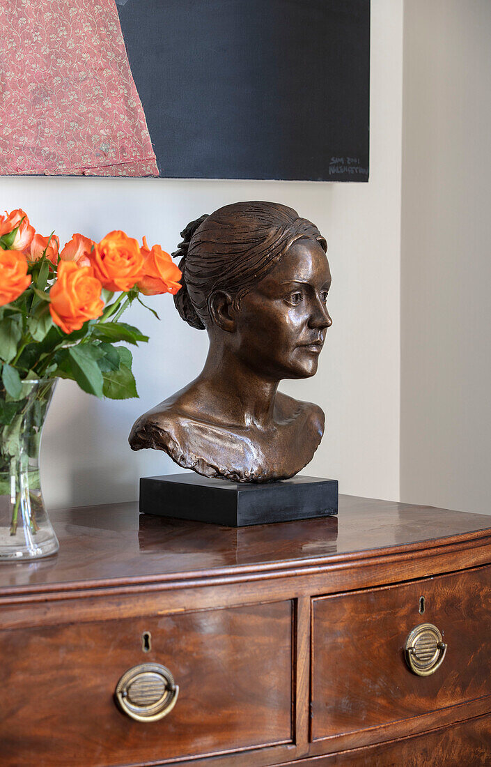 Bronze bust and roses on Georgian chest in Southwest London home UK