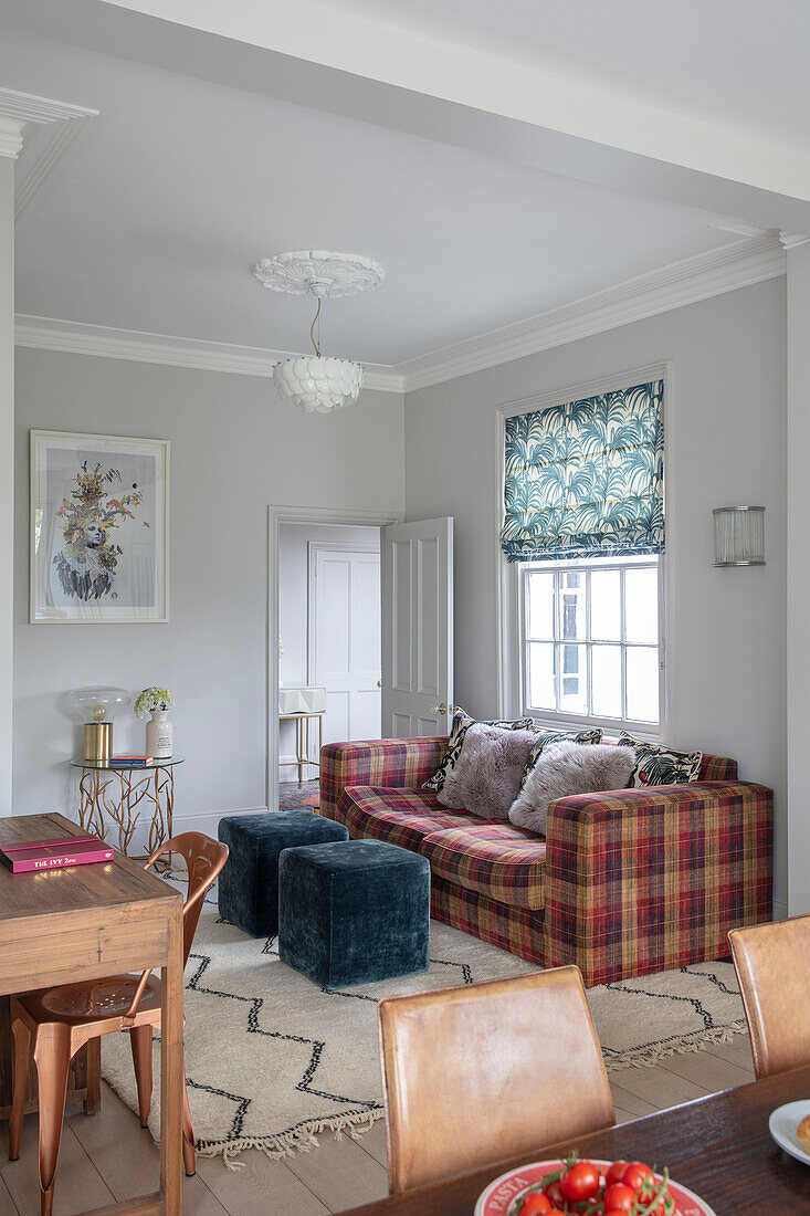 Teal cube seats with tartan sofa in window of Victorian villa Tunbridge Wells Kent UK