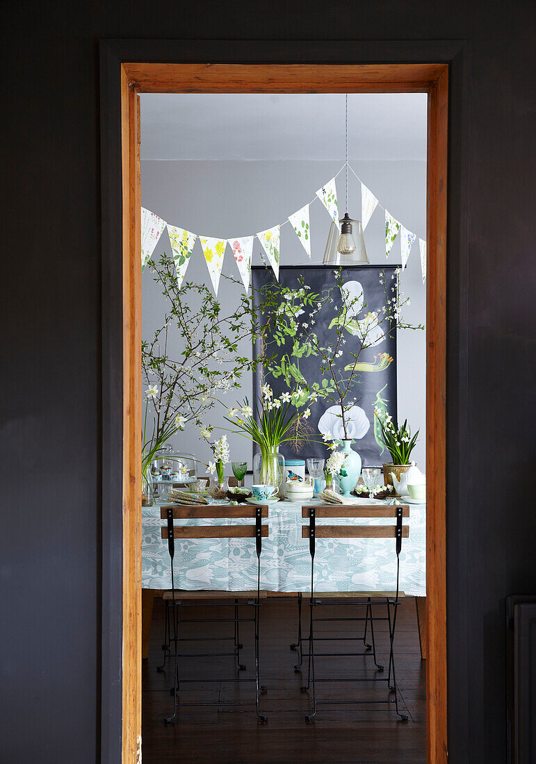 Easter Table setting through doorway with spring flowers