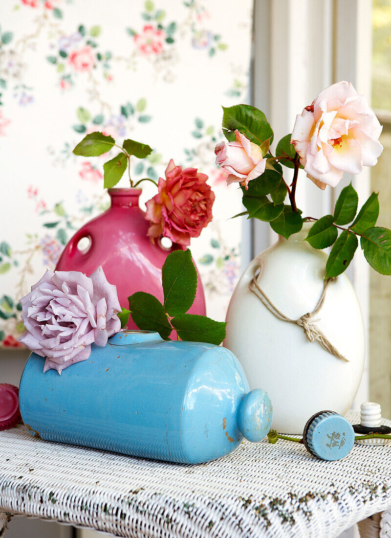 Cut roses in vintage ceramics in Isle of Wight home UK