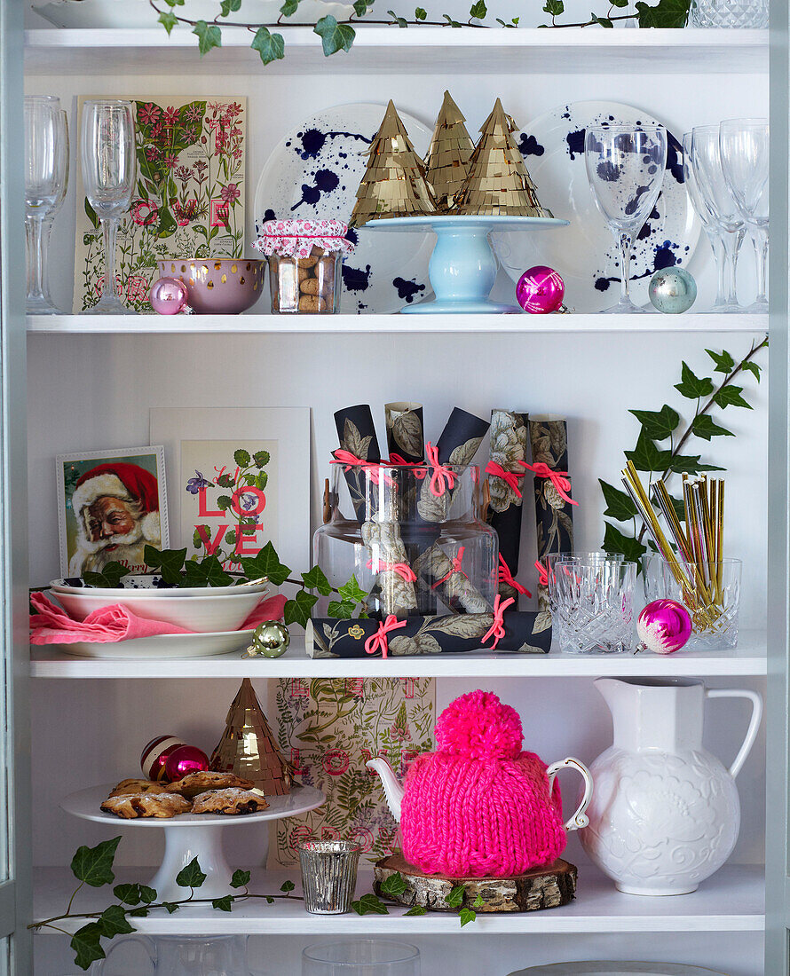 Shelves displaying festive objects including crackers cards and baubles