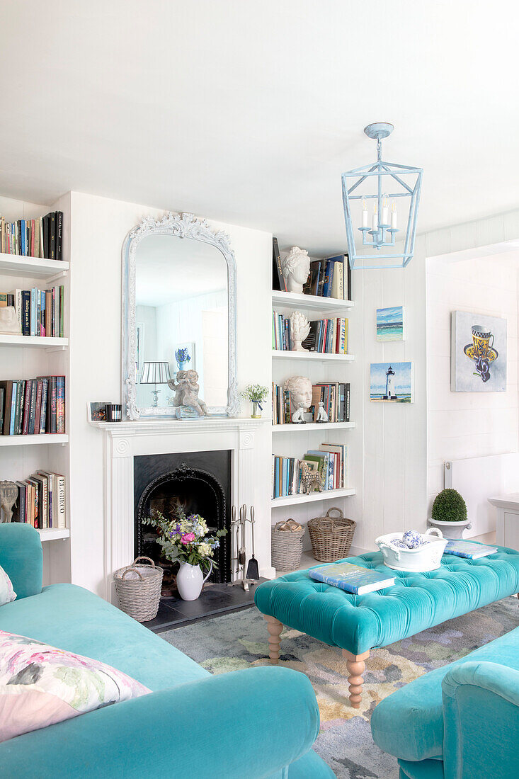 Bright living room with fireplace and turquoise furniture