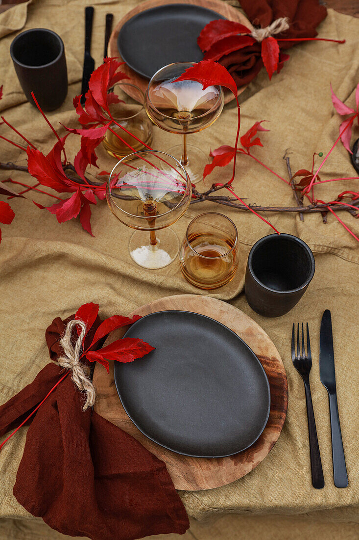 Table with linen tablecloth set in autumnal colours