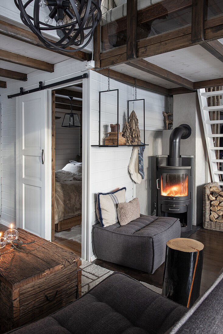 Rustic country-style living room with wooden beams and fireplace