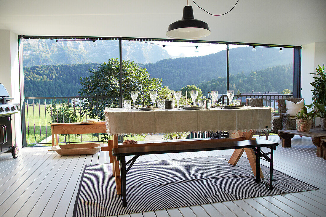 Set table with mountain view and pendant light