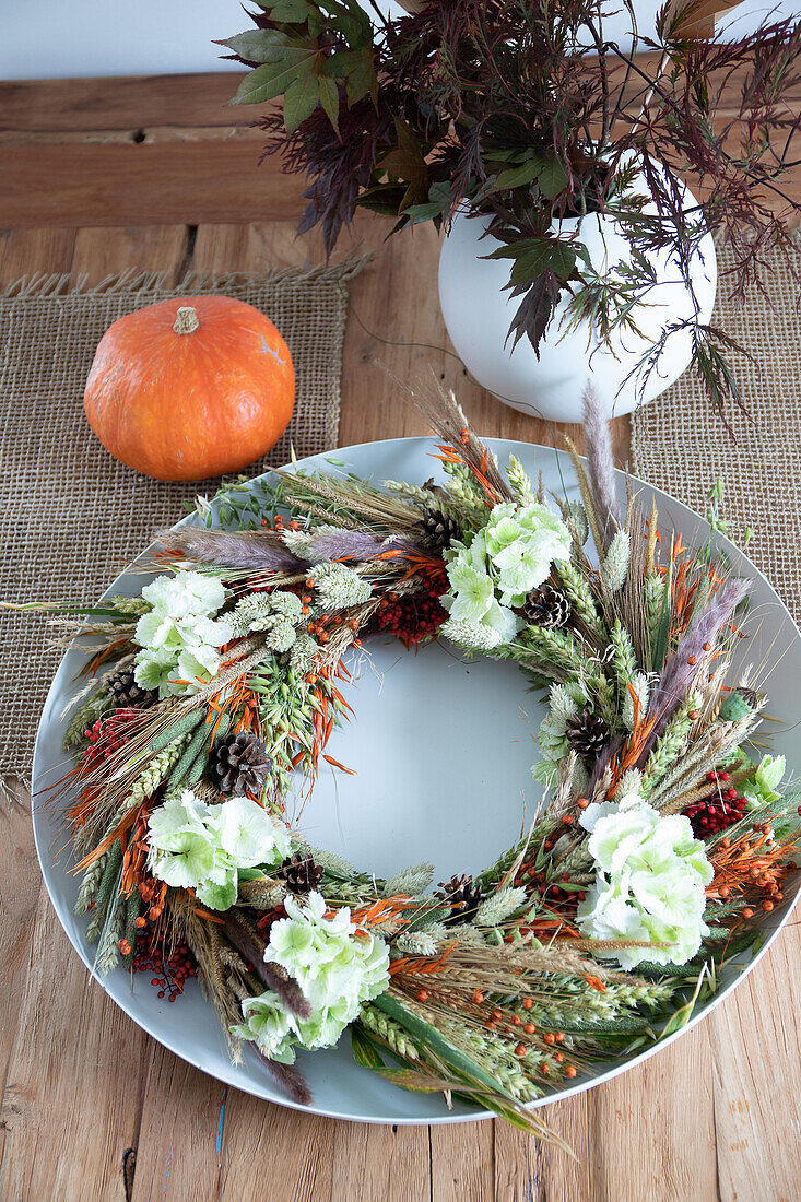 Homemade autumn wreath on a wooden table