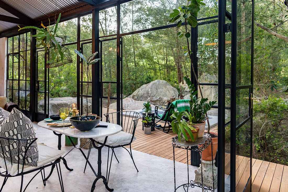 Open living room with dining area in the glasshouse