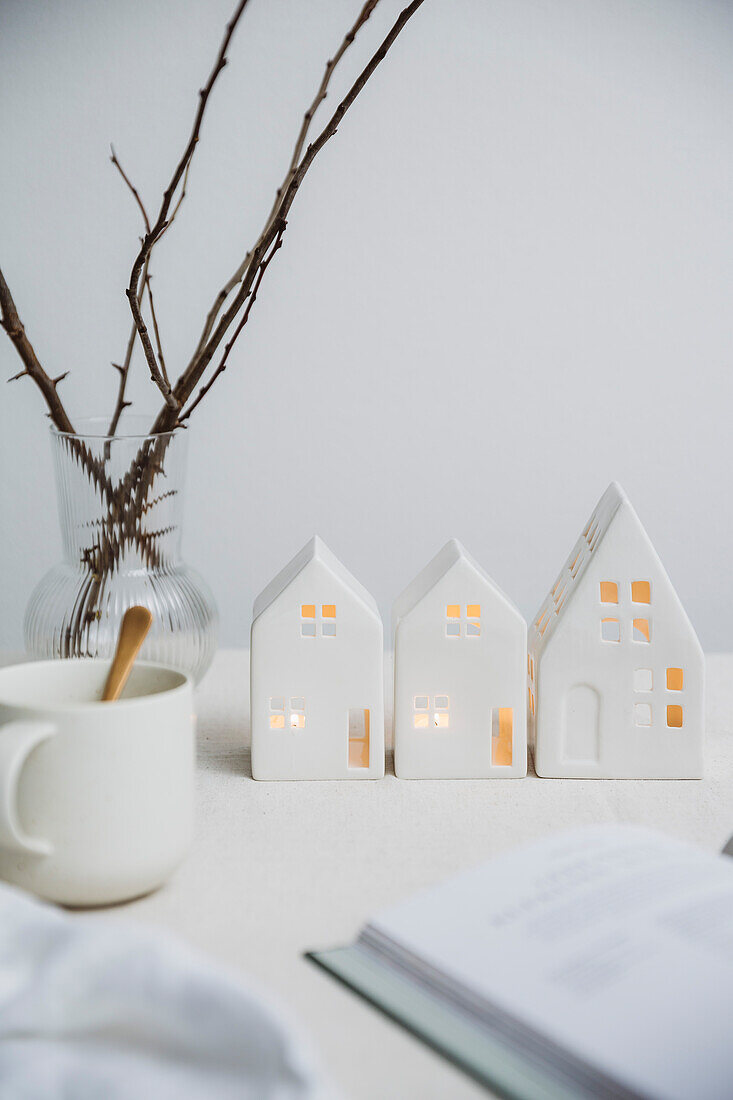 Tea light holder houses, twigs and white mug