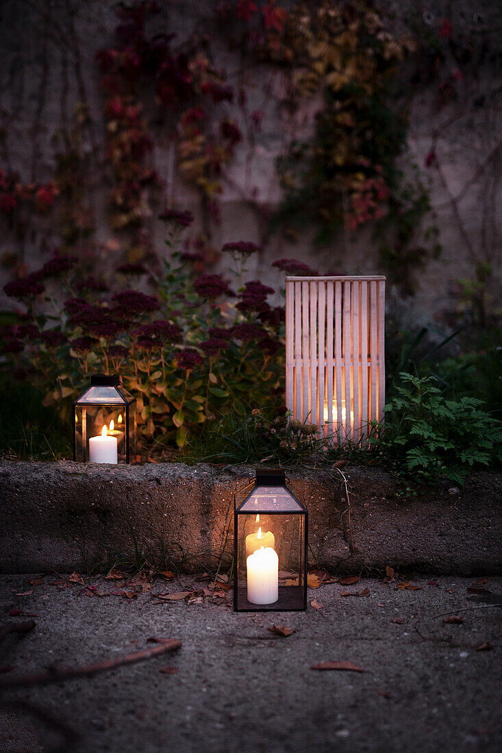Candle lanterns on autumnal terrace