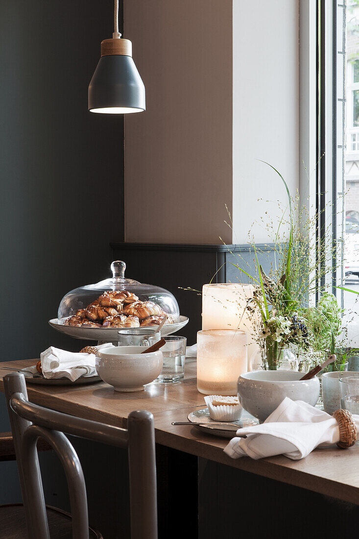 Table with pastries, with a hanging pendant light above