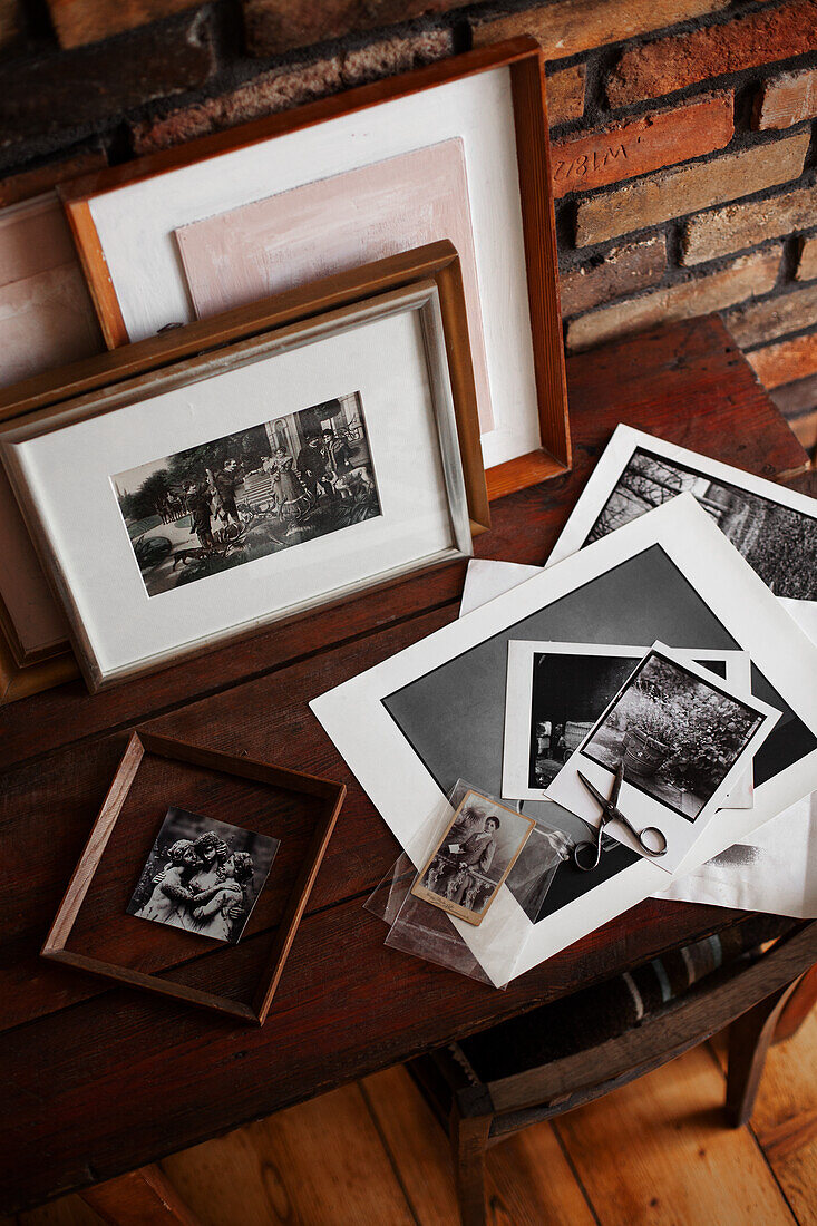 Black and white photos glued to the back of pictures