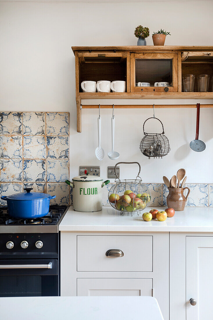 Kitchenette with antique cupboard and tiled backsplash
