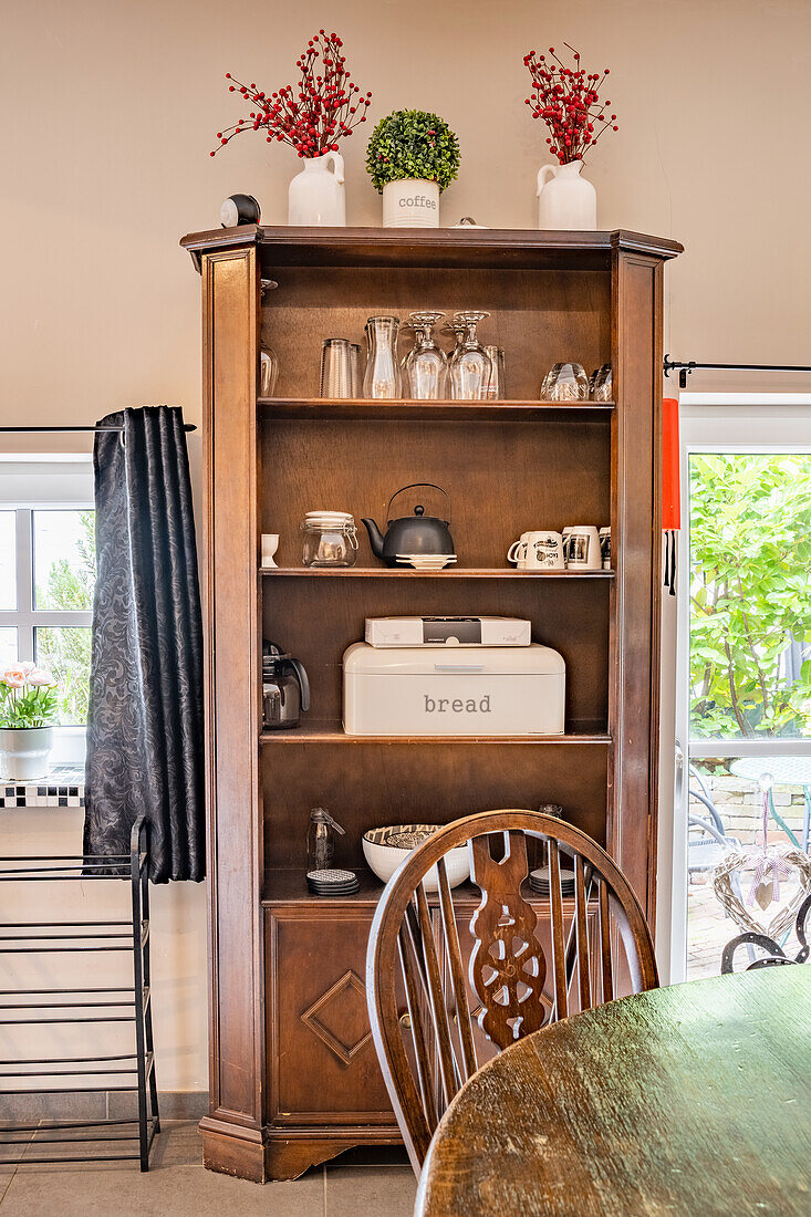 Shelf cupboard with stoneware and bread box