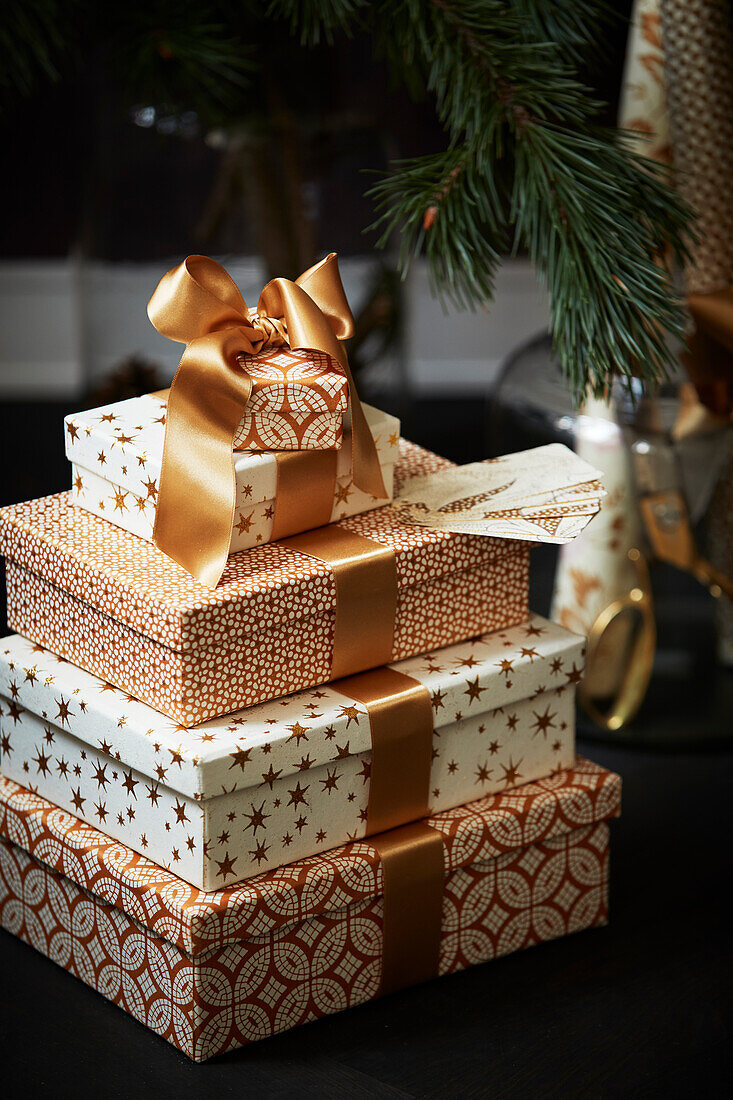 Christmas boxes with gold coloured ribbon