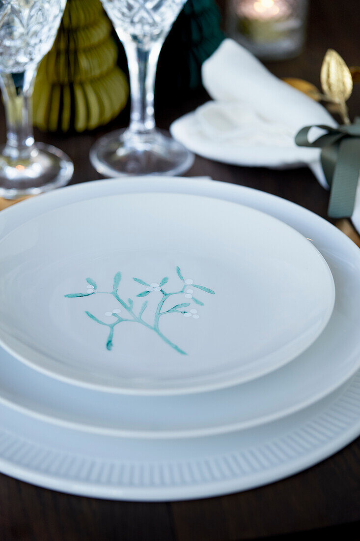 White place setting with hand-decorated plate