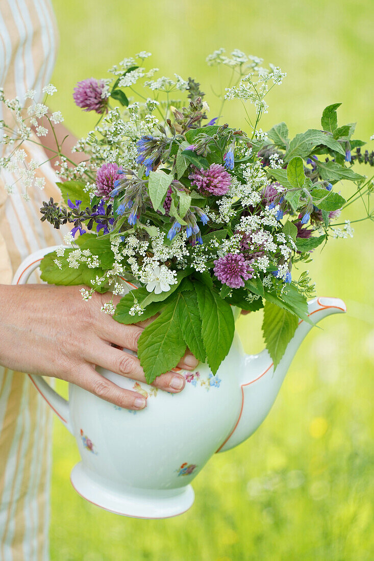 Bouquet of wild flowers in porcelain pot