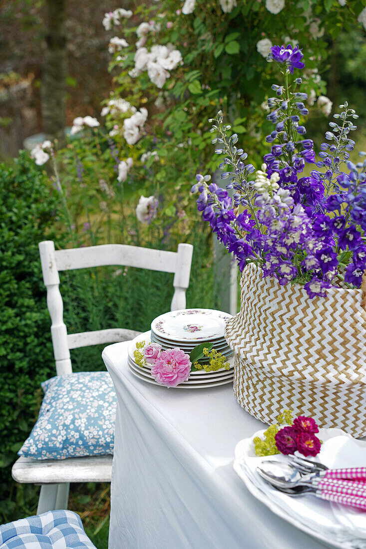 Laid garden table with floral decoration