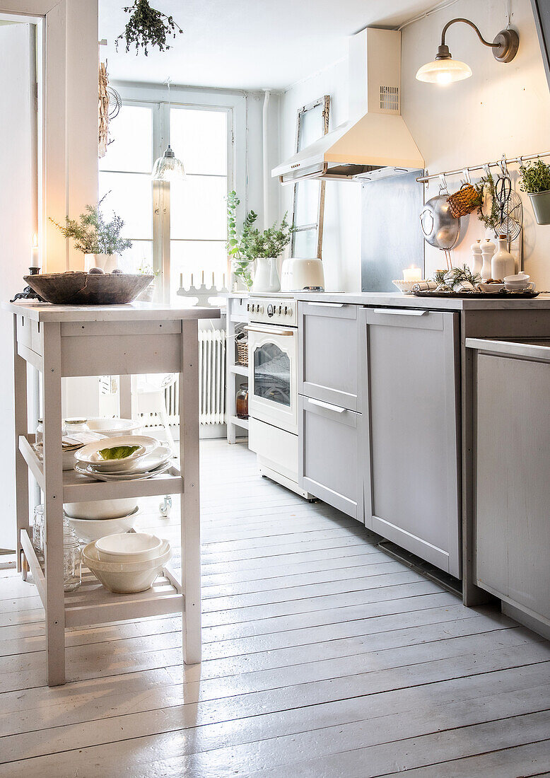 Bright kitchen with white wooden floor